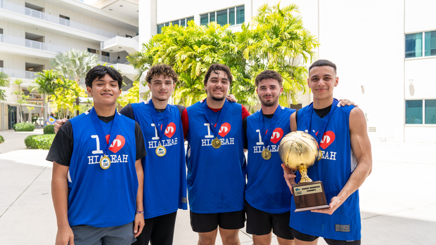 Hialeah Students Shark Madness Basketball tournament Winners holding Trophy